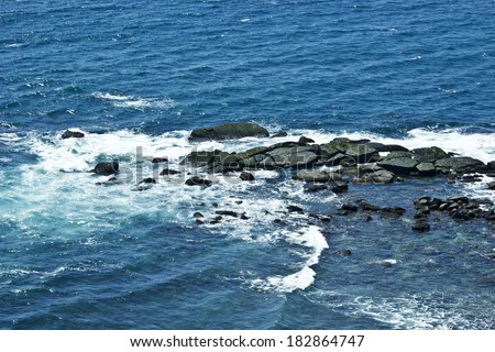 Waves and rocks on the Ocean from above. View from lighthouse, Matara, Ceylon, Sri Lanka