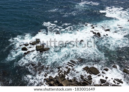 Waves, rocks, stones on the Ocean from above. View from lighthouse, Matara, Ceylon, Sri Lanka