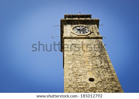 Old clock tower in Galle Fort Sri Lanka. Horizontal image with dark vignette effect
