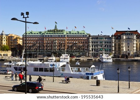 STOCKHOLM, SWEDEN - MAY 2: Embankment of Stockholm downtown witn Grand Hotel on May 2, 2014. Grand Hotel is one of the expensive hotels in Stockholm