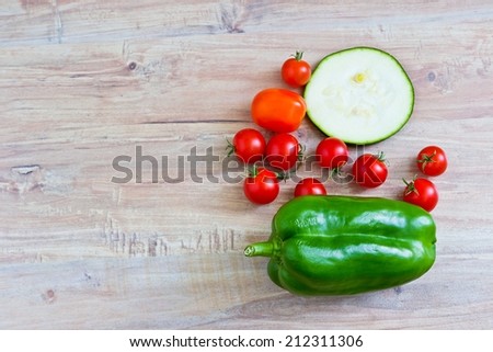 Fresh vegetables at wooden background. Horizontal image. Objects at the right part
