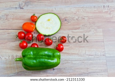 Fresh vegetables at wooden background. Horizontal image. Objects at the left part