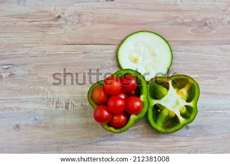 Fresh vegetables at wooden background close up. Horizontal image. Objects at the right part of image