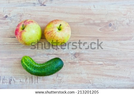Funny smiling face. Conceptual horizontal image with vegetables. Objects at the left part of image