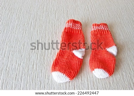 Colorful wool baby socks isolated on white background. Socks at the right part of image