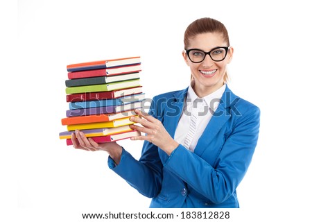 Happy woman presenting stack of books. Smiling elegance teacher in black glasses holding stack of books. Waist up studio shot isolated on white.