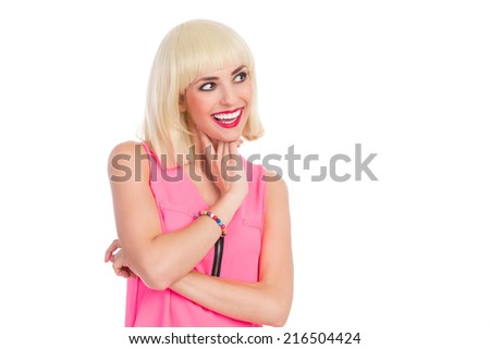 Close up of smiling beautiful blonde young woman looking away and holding hand on chin. Waist up studio shot isolated on white.