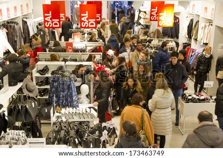 BOLOGNA, ITALY - JANUARY 25, 2014 - Hundreds of people flock at local shops to take advantage of the ongoing sale where products can go to 70 percent off.