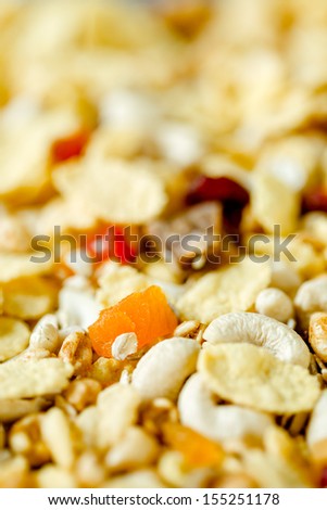 Homemade muesli with corn flakes, nuts and dried fruits. Close up
