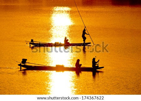 fishermen on boats silhouette