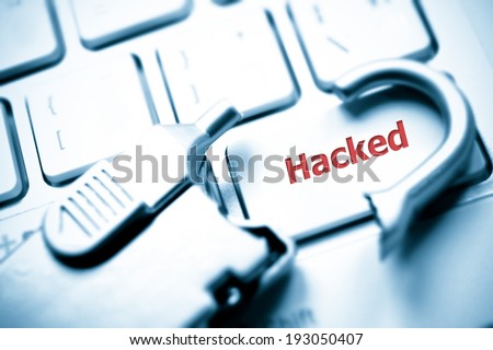 broken security lock on computer keyboard with hacked symbol