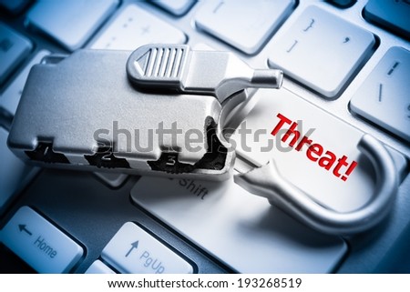 broken security lock on computer keyboard - Threat issue