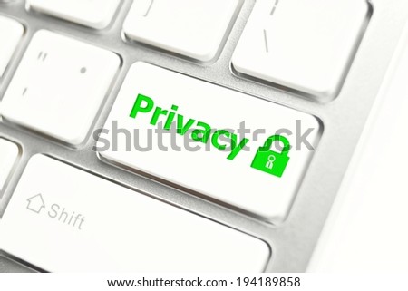 green security lock with privacy message on white computer keyboard - information privacy concept