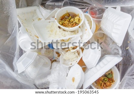 foam and plastic food container in the bin / environmental problems