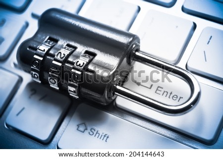 metal security lock with password on computer keyboard - security concept in computer