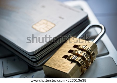 security lock on credit cards with computer keyboard - credit card data security