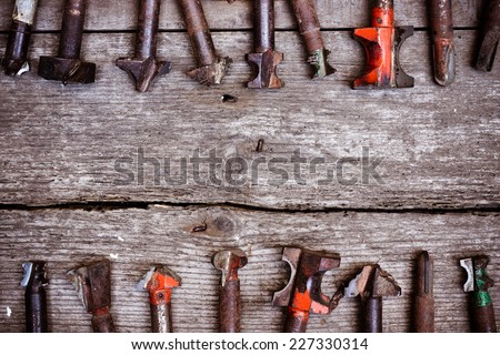 different types of drill bits on old wood background