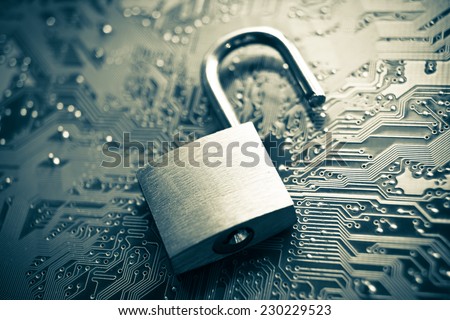 open security lock on computer circuit board - computer security concept