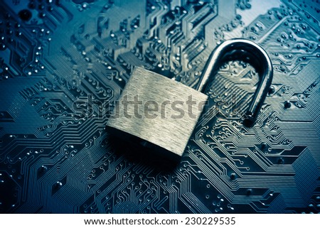 open security lock on computer circuit board - computer security breach concept