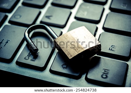 open security lock on computer keyboard - computer security breach concept