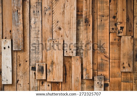 old and dirty wood planks with nail holes arranged as a wall background