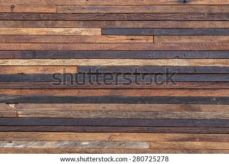 old pieces of wood plank arranged as a big wooden wall