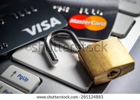 Ubonratchathani, Bangkok- June 6, 2015 : Close up of VISA and Mastercard credit card on white computer keyboard with security lock