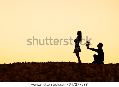A man kneeling down begging for love