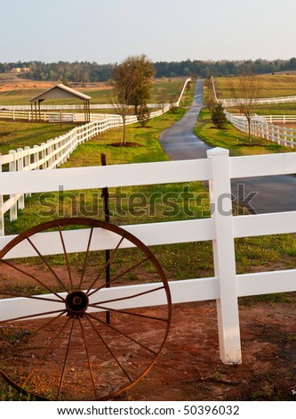 Wagon Wheel at Entrance of Modern horse ranch