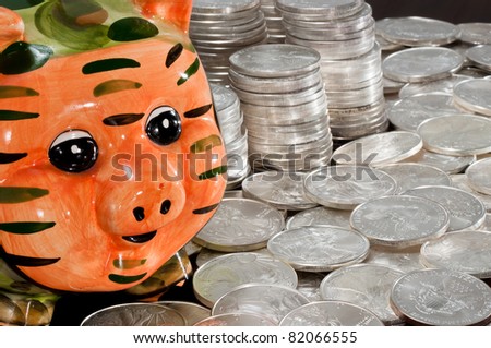 Piggy bank and silver dollars