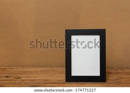Frame. Frame on a wooden table. Place for your text