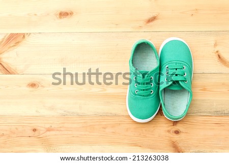 Green  shoes on wooden floor. Pair of shoes