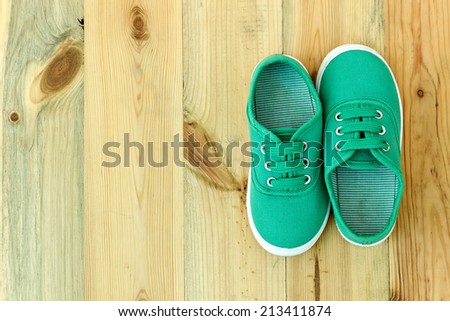 Running shoes on a wooden background. pair of shoes