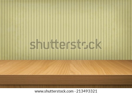 Background with wooden table and old wallpaper  stripes. Ready for product montage display