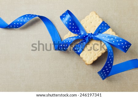 Cookies with blue ribbon. Cookie gift. Top view. Place for your text