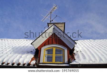 Ceiling windows on houses with snow on the roof