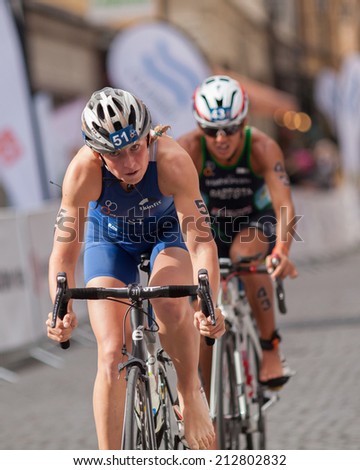 STOCKHOLM - AUG, 23:  World Triathlon  event Aug 23, 2014. woman bikes in Old town, Stockholm, Sweden. Kaidi Kivioja, EST.