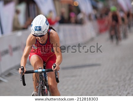 STOCKHOLM - AUG, 23:  World Triathlon  event Aug 23, 2014. woman bikes in Old town, Stockholm, Sweden. Ainhoa Murua, ESP.