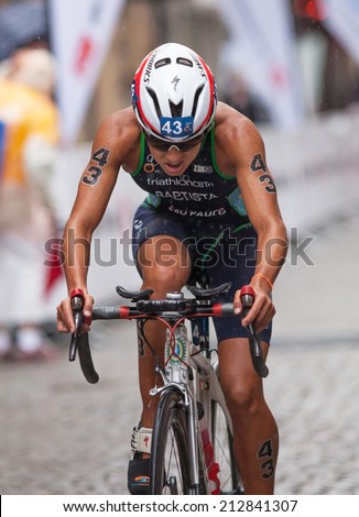 STOCKHOLM - AUG, 23:  World Triathlon  event Aug 23, 2014. woman bikes in Old town, Stockholm, Sweden. Luisa Baptista, BRA.