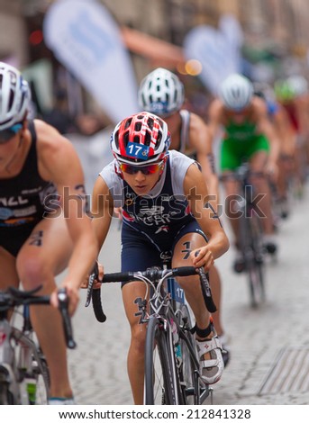 STOCKHOLM - AUG, 23:  World Triathlon  event Aug 23, 2014. woman bikes in Old town, Stockholm, Sweden: Barbara Riveros, CHI.