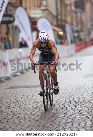 STOCKHOLM - AUG, 23:  World Triathlon  event Aug 23, 2014. woman running in Old town, Stockholm, Sweden. Luisa Baptista, BRA.