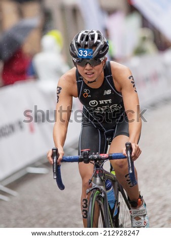 STOCKHOLM - AUG, 23:  World Triathlon  event Aug 23, 2014. woman running in Old town, Stockholm, Sweden. Yurie Kato, JAP.