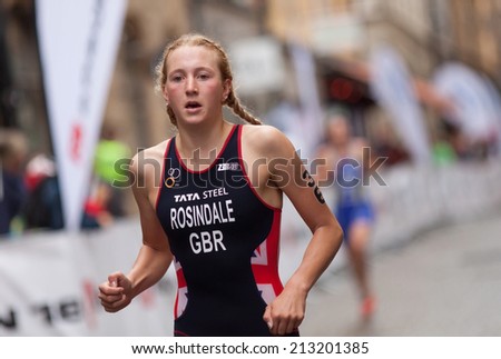STOCKHOLM - AUG, 23:  World Triathlon  event Aug 23, 2014. woman running in Old town, Stockholm, Sweden.  Lois Rosindale, GBR.