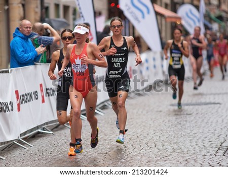 STOCKHOLM - AUG, 23:  World Triathlon  event Aug 23, 2014. woman running in Old town, Stockholm, Sweden