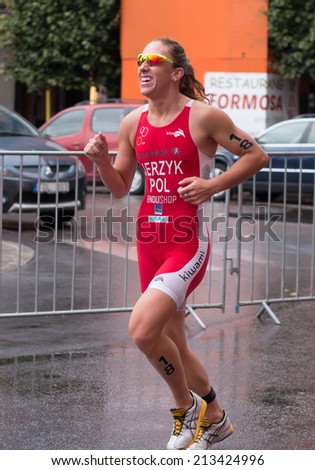 STOCKHOLM - AUG, 23:  World Triathlon  event Aug 23, 2014. woman running in Old town, Stockholm, Sweden. Agnieszka Jerzyk, POL.