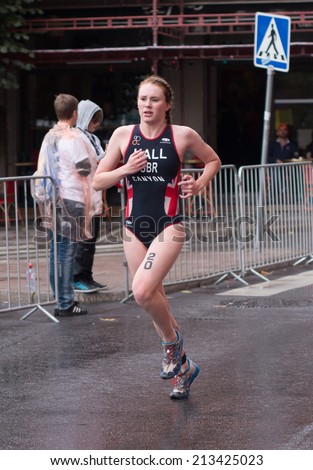 STOCKHOLM - AUG, 23:  World Triathlon  event Aug 23, 2014. woman running in Old town, Stockholm, Sweden. Lucy Hall, GBR.