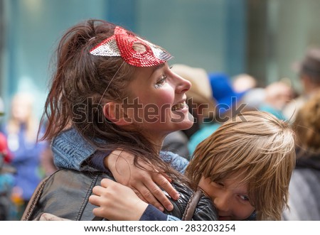 STOCKHOLM, SWEDEN - MAY 31, 2015. Unidentified woman and child attending the Peace and Love Parade. Street party in Stockholm.