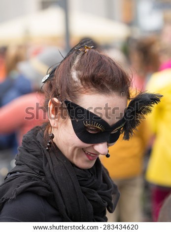 STOCKHOLM, SWEDEN - MAY 31, 2015. Peace and Love Parade. Street party in Stockholm,  Young woman with black mask on the eyes.