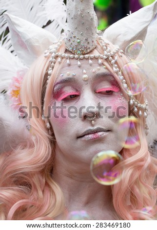 STOCKHOLM, SWEDEN - MAY 31, 2015. Peace and Love Parade. Street party in Stockholm. Painted woman with pearls and Nose Ring.