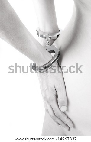 stock photo highkey of a handcuffed woman Save to a lightbox
